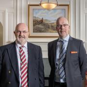 Nicholson Portnell Senior Partner Richard Nelson with Cartmell Shepherd Solicitors Managing Director Peter Stafford.