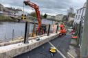Self-cleaning glass flood panels being installed at Waterside, Kendal