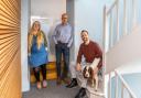 Promoted to associate architects are Amy Redman, Andrew Bodenham, Gordon Blunt. Pictured with Tess the dog