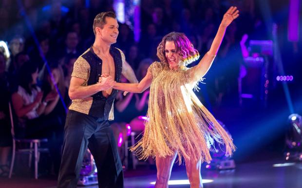 In Cumbria: Pasha Kovalev and Caroline Flack on the live show of the BBC programme Strictly Come Dancing. Credit: PA