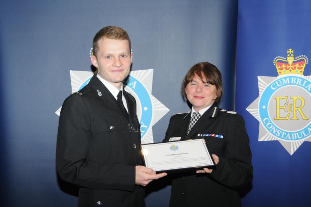 Police Constable Joe Tidmarsh receiving his award.