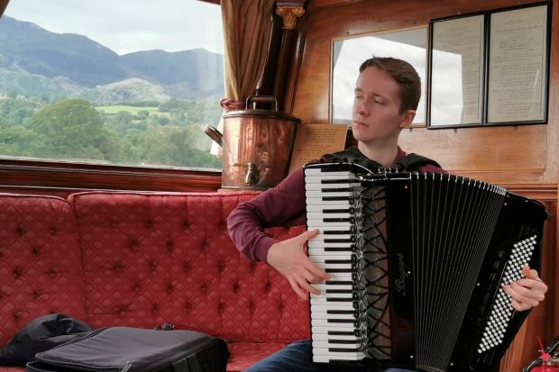 Ryan Corbett played the accordion on a gondola