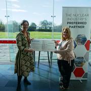 NSG's Director of Consultancy Services Gráinne Carpenter presenting a cheque to Home to Work Managing Director Karen Jones